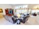 Spacious living room with tile flooring, vaulted ceilings, and sliding glass doors to the pool area at 7148 N Blue Sage, Punta Gorda, FL 33955