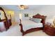 Large main bedroom with furniture, a ceiling fan, and neutral wall-to-wall carpeting at 7148 N Blue Sage, Punta Gorda, FL 33955