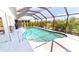 Screened-in swimming pool with clear water and landscaped surroundings at 7148 N Blue Sage, Punta Gorda, FL 33955