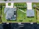 Aerial perspective of a waterfront property, showcasing its proximity to the water and landscaping at 1025 Cheshire St, Port Charlotte, FL 33953