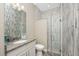 The bathroom features a marble tile shower, granite counters, and a modern sink at 1025 Cheshire St, Port Charlotte, FL 33953