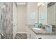 The bathroom features a modern sink, granite counters, and decorative accents at 1025 Cheshire St, Port Charlotte, FL 33953
