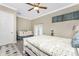 This bedroom features a colorful rug, and a crib is visible in the background at 1025 Cheshire St, Port Charlotte, FL 33953