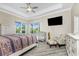 The spacious main bedroom is complete with stylish furnishings and tray ceiling at 1025 Cheshire St, Port Charlotte, FL 33953