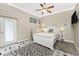 This bedroom features a colorful rug, ceiling fan, and is brightly lit at 1025 Cheshire St, Port Charlotte, FL 33953