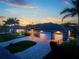 The home features mature palms, a paver drive, and a sprawling front lawn at 1025 Cheshire St, Port Charlotte, FL 33953