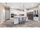 Bright, modern kitchen with an island, stainless steel refrigerator, and ample storage at 1025 Cheshire St, Port Charlotte, FL 33953