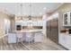 Spacious kitchen with a large island, stainless steel appliances, and white cabinetry at 1025 Cheshire St, Port Charlotte, FL 33953