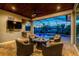 Beautiful lanai features comfortable seating with a fire pit, along with a stunning pool at 1025 Cheshire St, Port Charlotte, FL 33953