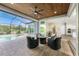 Covered lanai featuring a full view of the swimming pool and patio seating at 1025 Cheshire St, Port Charlotte, FL 33953