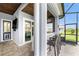 Covered lanai with bar, dog door, and views to the swimming pool at 1025 Cheshire St, Port Charlotte, FL 33953