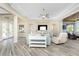 Spacious living area featuring wood floors, high ceilings, neutral decor, and views of the outdoors at 1025 Cheshire St, Port Charlotte, FL 33953
