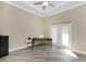 Office space with wood-look flooring, natural light from the double doors, and classic decor at 1025 Cheshire St, Port Charlotte, FL 33953