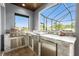 Outdoor kitchen featuring stainless appliances, a grill, and a sink at 1025 Cheshire St, Port Charlotte, FL 33953