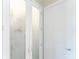 A pantry with a decorative glass door adjacent to a solid white door at 1025 Cheshire St, Port Charlotte, FL 33953