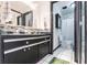 Well-maintained bathroom includes a double sink vanity, black accents, and separate toilet/shower room at 10289 60Th N Cir, Pinellas Park, FL 33782