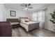 Comfortable bedroom with natural light, wood-look flooring, ceiling fan and a cozy, inviting atmosphere at 10289 60Th N Cir, Pinellas Park, FL 33782