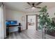 Inviting living room with an open layout, featuring modern flooring, a ceiling fan, and an open doorway to another living area at 10289 60Th N Cir, Pinellas Park, FL 33782