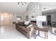 Bright living room showcasing a stone fireplace, neutral decor, and tiled floors at 10289 60Th N Cir, Pinellas Park, FL 33782