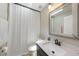 Bright bathroom featuring a shower, a sink with vanity, and a skylight at 1039 Marlene St, Port Charlotte, FL 33952