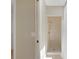 Bathroom with walk-in tiled shower with glass door and bench at 1039 Marlene St, Port Charlotte, FL 33952