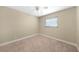 Neutral bedroom featuring carpeted floors, a ceiling fan, and a window at 1039 Marlene St, Port Charlotte, FL 33952