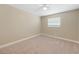 Neutral bedroom featuring carpeted floors, a ceiling fan, and a window at 1039 Marlene St, Port Charlotte, FL 33952