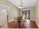 Dining room with views of kitchen and screened in lanai with a lovely dining table at 1039 Marlene St, Port Charlotte, FL 33952