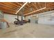 Expansive 3-car garage equipped with a car lift, perfect for car enthusiasts, offering lots of room for hobbies and repairs at 1039 Marlene St, Port Charlotte, FL 33952