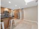 Bright kitchen with stainless steel appliances, bar seating, and large tile flooring at 1039 Marlene St, Port Charlotte, FL 33952