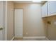 Utility room with washer hookups and upper cabinets for storage solutions at 1039 Marlene St, Port Charlotte, FL 33952