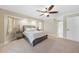 Spacious main bedroom with large bed, tray ceiling, and neutral carpeting at 1039 Marlene St, Port Charlotte, FL 33952