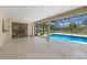 Relaxing screened in patio with swimming pool and view of the property at 1039 Marlene St, Port Charlotte, FL 33952
