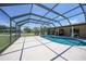 Beautiful screened-in pool with ample patio space and inviting blue water at 1039 Marlene St, Port Charlotte, FL 33952