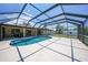 Enjoy the outdoors in this screened-in pool with ample deck space, perfect for entertaining and relaxing by the water at 1039 Marlene St, Port Charlotte, FL 33952