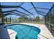 Inviting pool encased in a screened-in lanai, promising endless days of refreshing swims and fun gatherings in a private outdoor setting at 1039 Marlene St, Port Charlotte, FL 33952