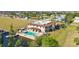 Expansive waterfront home featuring a private pool, boat dock, and stunning architectural design at 1217 Aqui Esta Dr # 5, Punta Gorda, FL 33950