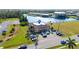 Aerial view of a well-maintained building with parking and landscaping, offering a desirable location at 1217 Aqui Esta Dr # 5, Punta Gorda, FL 33950