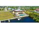 Aerial view of the community with water access, community pool and boat dock at 1217 Aqui Esta Dr # 5, Punta Gorda, FL 33950