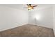 Bright bedroom featuring neutral carpet, ceiling fan with light fixture at 1217 Aqui Esta Dr # 5, Punta Gorda, FL 33950