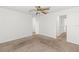 Spacious bedroom with neutral carpeting and access to the bath area at 1217 Aqui Esta Dr # 5, Punta Gorda, FL 33950