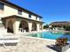 Beautiful view of the community pool with a covered patio area, ideal for relaxing and enjoying outdoor living at 1217 Aqui Esta Dr # 5, Punta Gorda, FL 33950