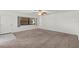 Spacious living room filled with natural light and neutral-toned carpet at 1217 Aqui Esta Dr # 5, Punta Gorda, FL 33950