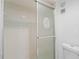 Close-up of tiled shower enclosure with sliding glass doors at 1217 Aqui Esta Dr # 5, Punta Gorda, FL 33950