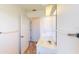 Bright bathroom featuring a single sink with marble countertops and white cabinets at 1351 Washington Dr, Englewood, FL 34224