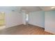 This bedroom has hardwood flooring and an attached bathroom at 1351 Washington Dr, Englewood, FL 34224