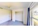 A bedroom featuring a window, closet, and carpet at 1351 Washington Dr, Englewood, FL 34224