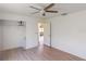 Open bedroom with closet and wood-look floors at 1351 Washington Dr, Englewood, FL 34224