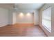 This large bedroom is bright with natural lighting and hardwood floors at 1351 Washington Dr, Englewood, FL 34224