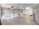 A large three-car garage features ample space and two doors at 1351 Washington Dr, Englewood, FL 34224